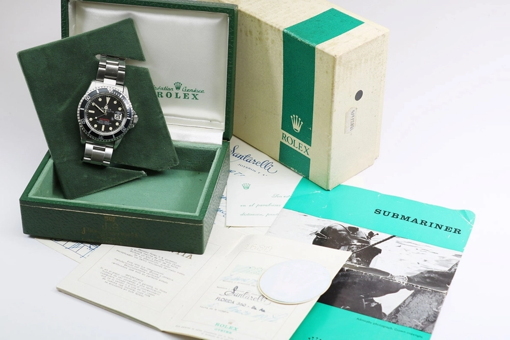 2023 Red Rolex Submariner Ref. 1680 showing the watch with its original box and paperwork